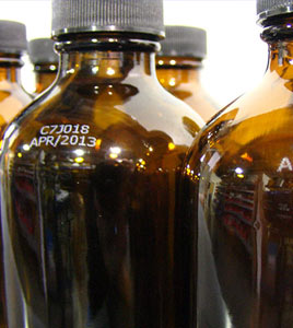 White Inkjet Coding on Amber Bottles